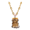 Carved Burmese Jade with hammered gold link chain and sapphire accents