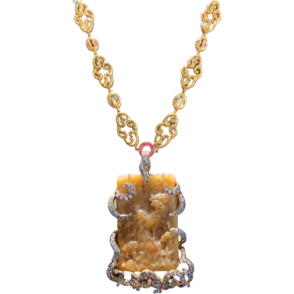 Carved Burmese Jade with hammered gold link chain and sapphire accents